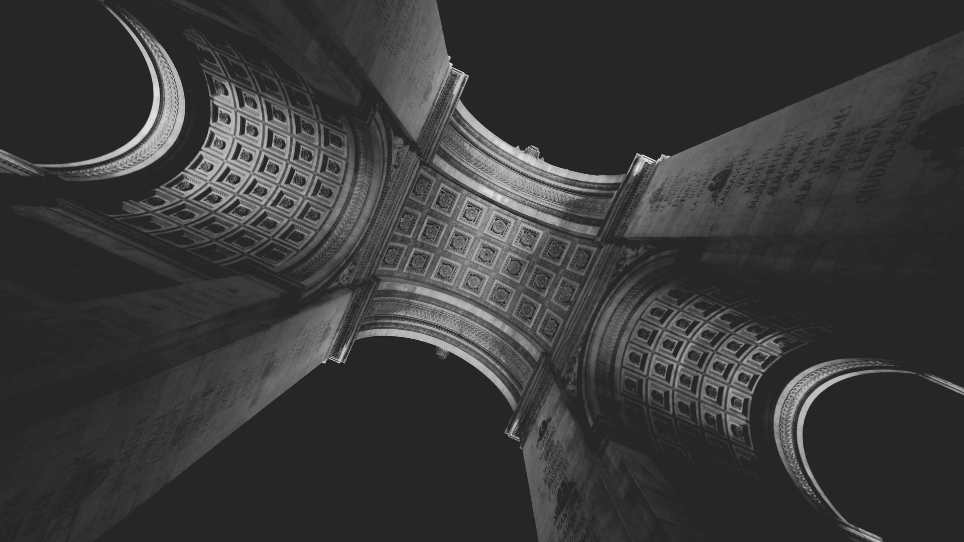 Editorial context photo of repeating architectural cylinders and shadows