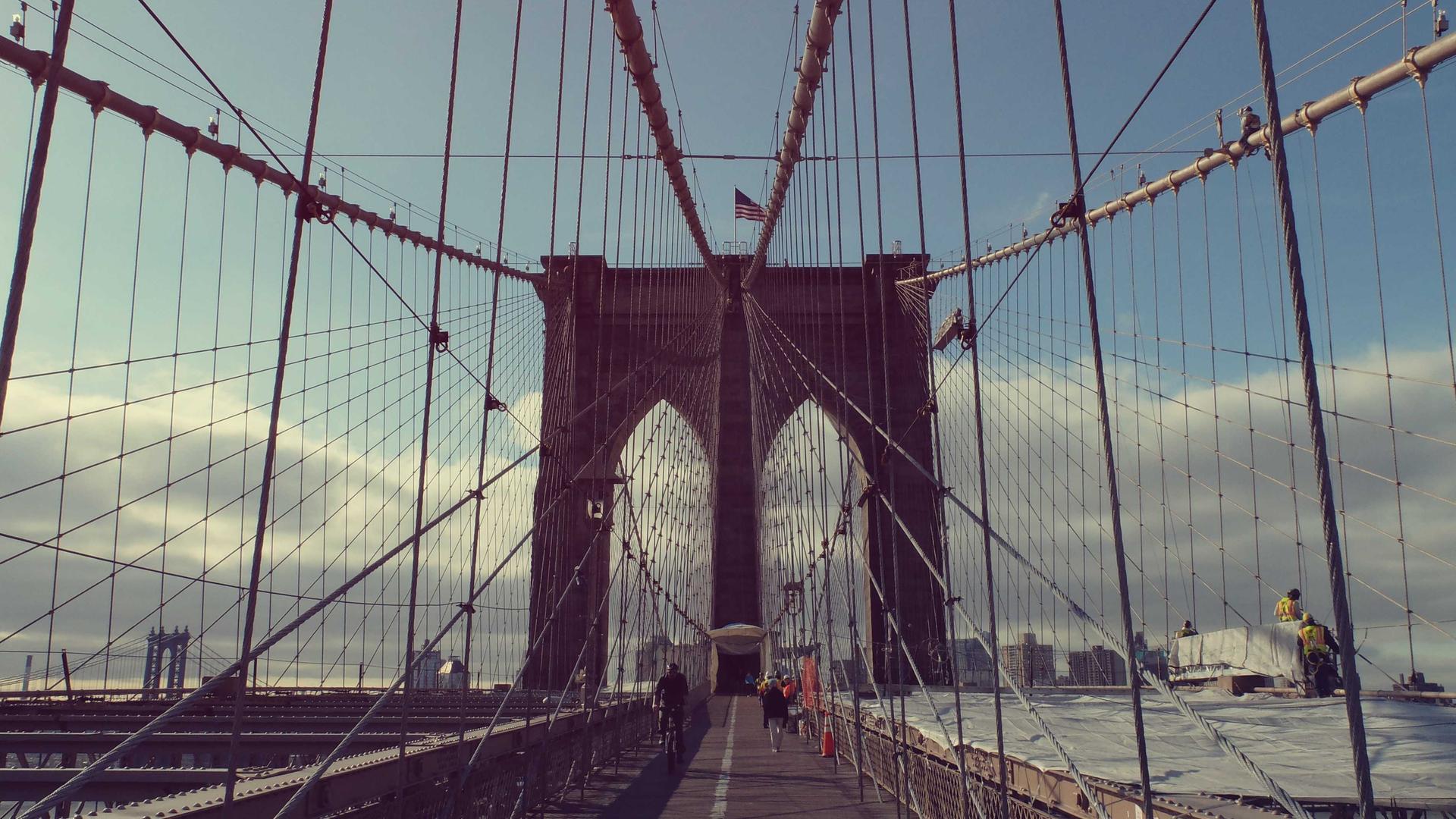 Editorial context photo of a suspension bridge in fog